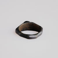 Top-down view of Roman bronze ring Numerius showing tapering shoulders