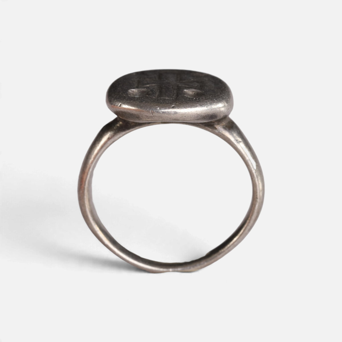 Byzantine silver ring 'Chrysanthos' shows the raised circular bezel above its complete hoop in profile.