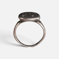 Byzantine silver ring 'Chrysanthos' shows the raised circular bezel above its complete hoop in profile.