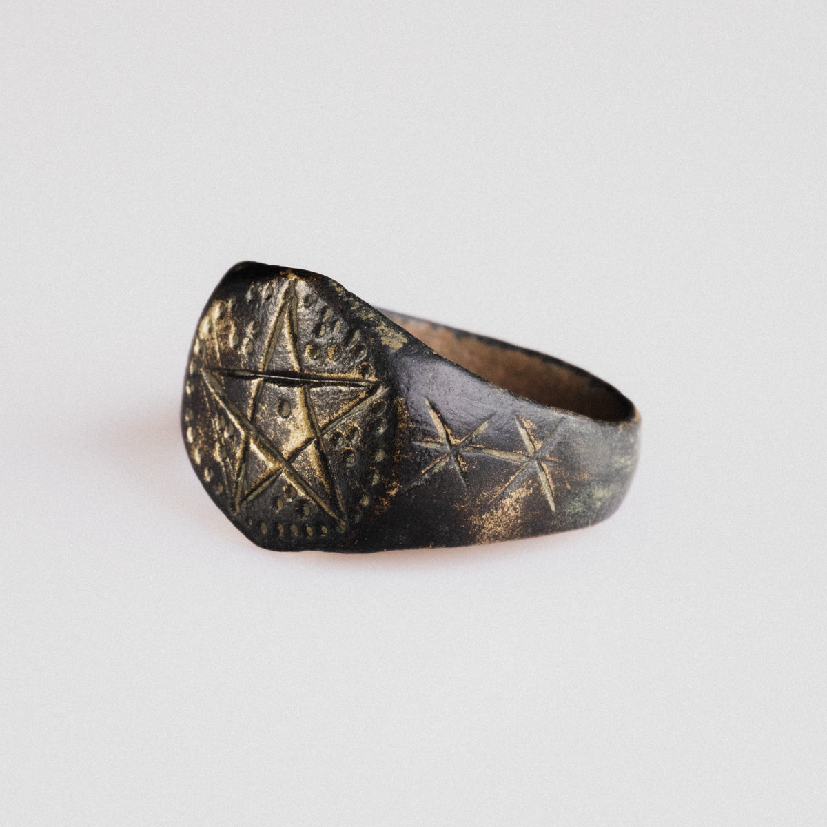 Top view of medieval bronze ring Astariel with full pentagram and dotted framing