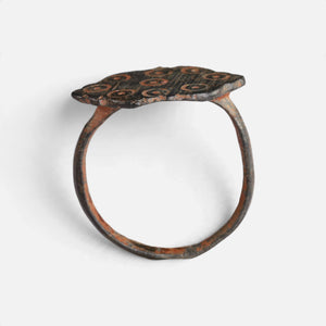 Medieval bronze ring 'Radvina' shows its lobed bezel edge above the complete hoop in profile.