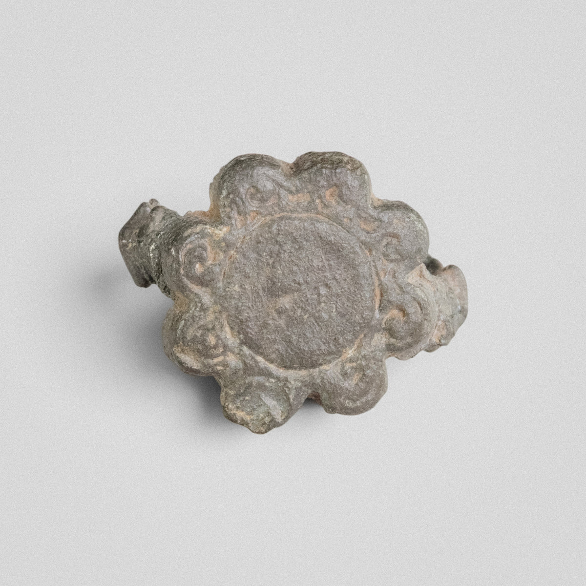 Top view of medieval bronze ring Rosalind revealing the flower-shaped bezel outline