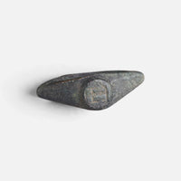 Roman bronze ring 'Hesperia' shows its small circular bezel between broad pointed shoulders.