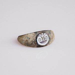 Top view of Roman bronze ring Volusia showing oval bezel and scrolling volute motif