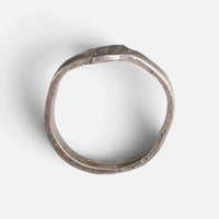 Roman silver ring 'Sextus' shows its complete hoop and the narrow bezel edge in profile.