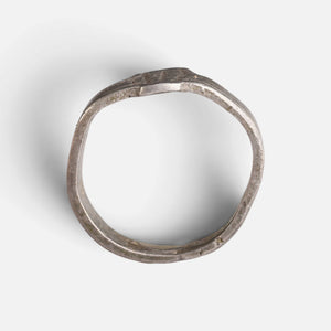 Roman silver ring 'Sextus' shows its complete hoop and the narrow bezel edge in profile.