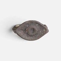 Roman bronze ring 'Catulla' shows concentric circular decoration within its pointed oval bezel.
