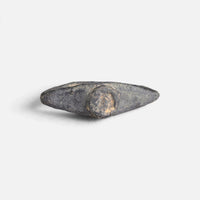 Roman bronze ring 'Equidus' shows its small circular bezel between broad pointed shoulders.