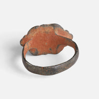 Medieval bronze ring 'Radvina' shows the reddish back of its lobed bezel and the inner hoop.
