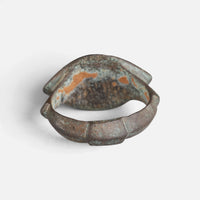 Roman bronze ring 'Catulla' shows the back of its pointed oval bezel and the inside of the hoop.