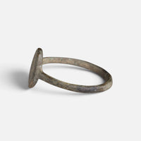 Byzantine bronze ring 'Kassia' shows its oval bezel edge and hoop from the opposite side.