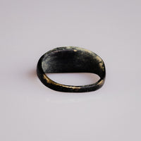 Underside view of Roman bronze ring Numerius showing worn inner band and patina