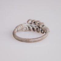 Roman silver wire ring 'Nodus' shows the backs of its loop rows above the plain hoop.